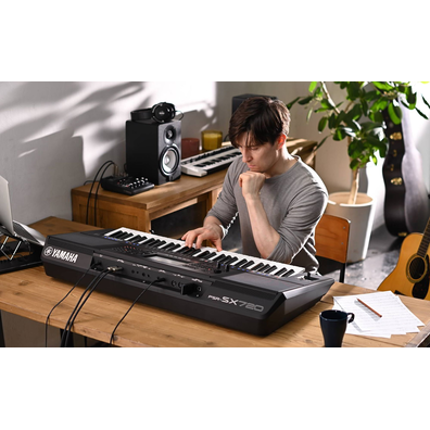 Photo of a person playing Yamaha Arranger Workstation PSR-SX720