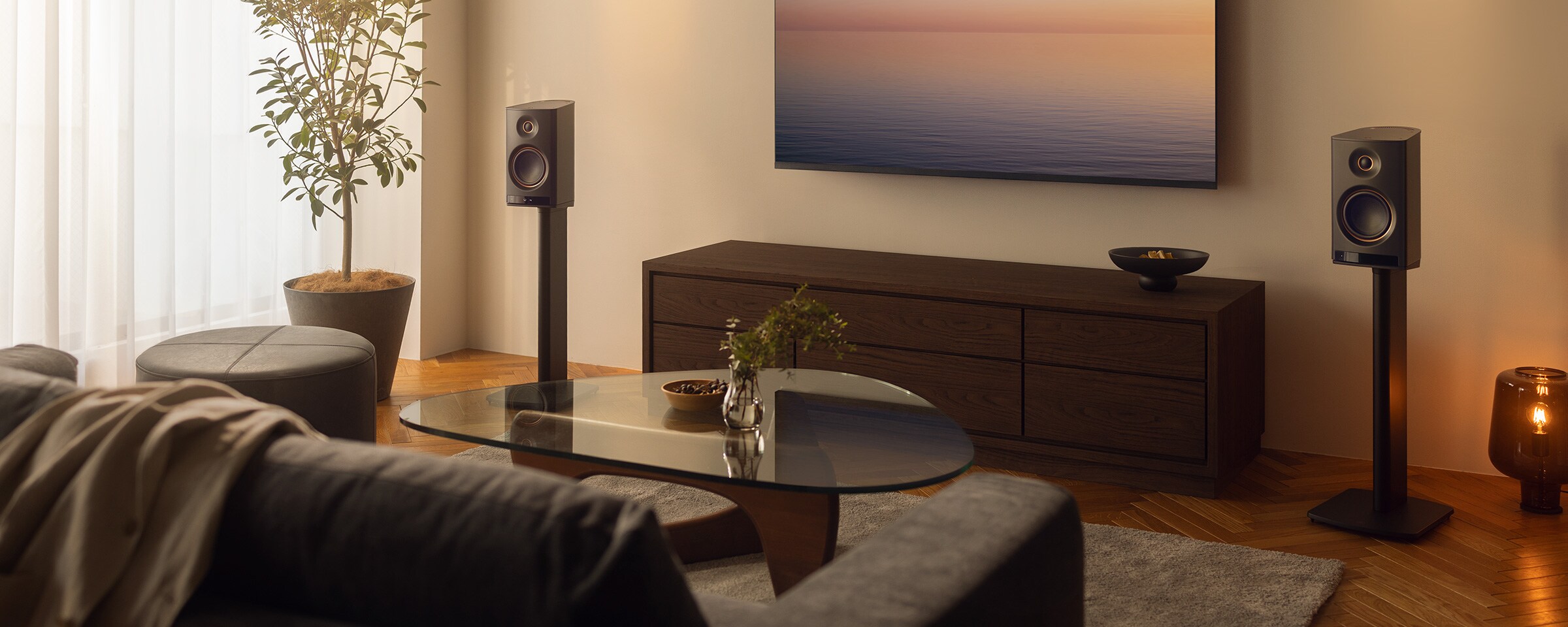 NX-70A wireless Hi-Fi speaker placed beside a TV in a modern living room