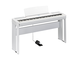 Diagonal side view of the P-525WH (white model) in combination with the optional stand and metal sustain pedal