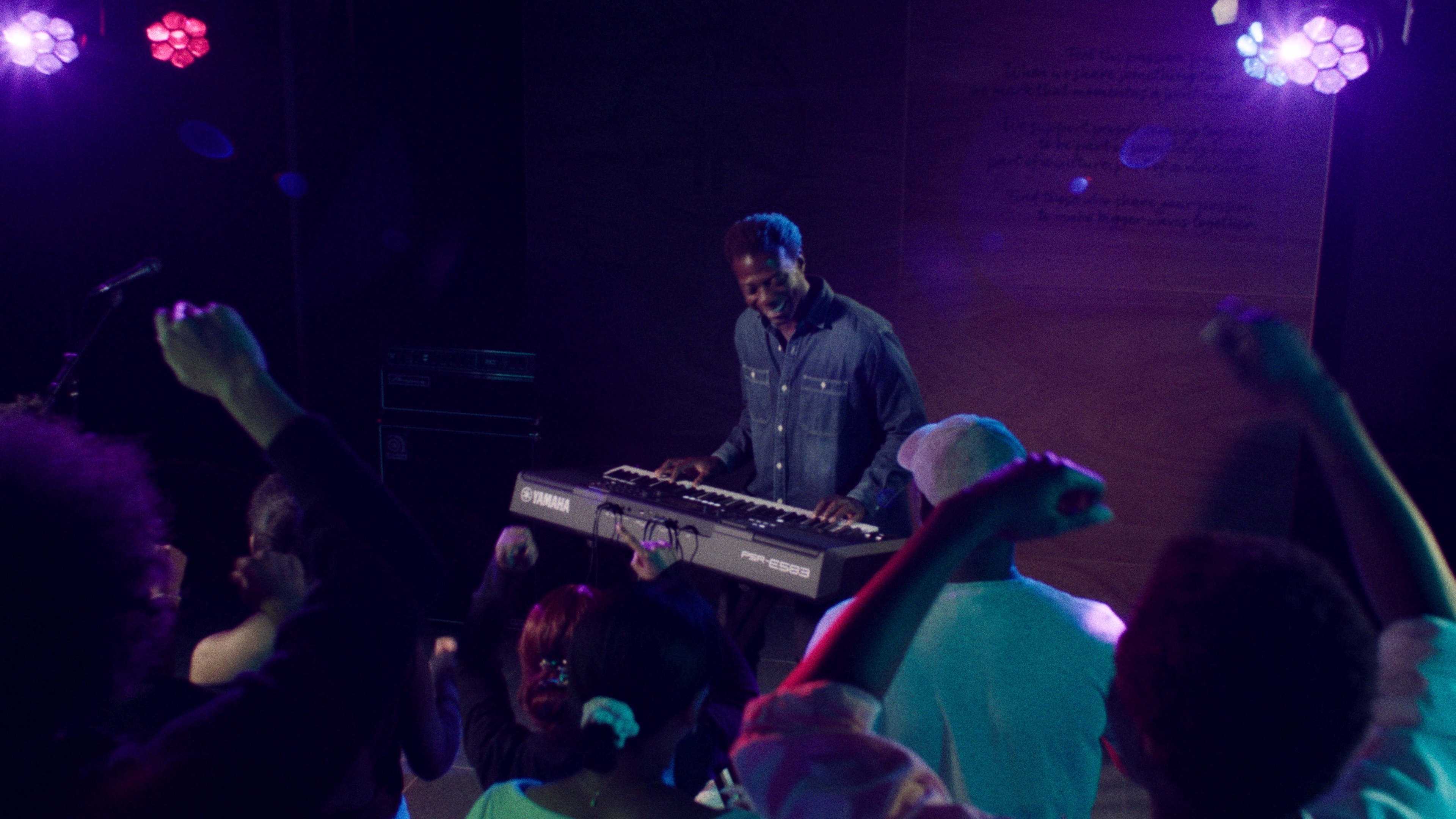 A person playing Yamaha Portable Keyboard PSR-E583 with headphones