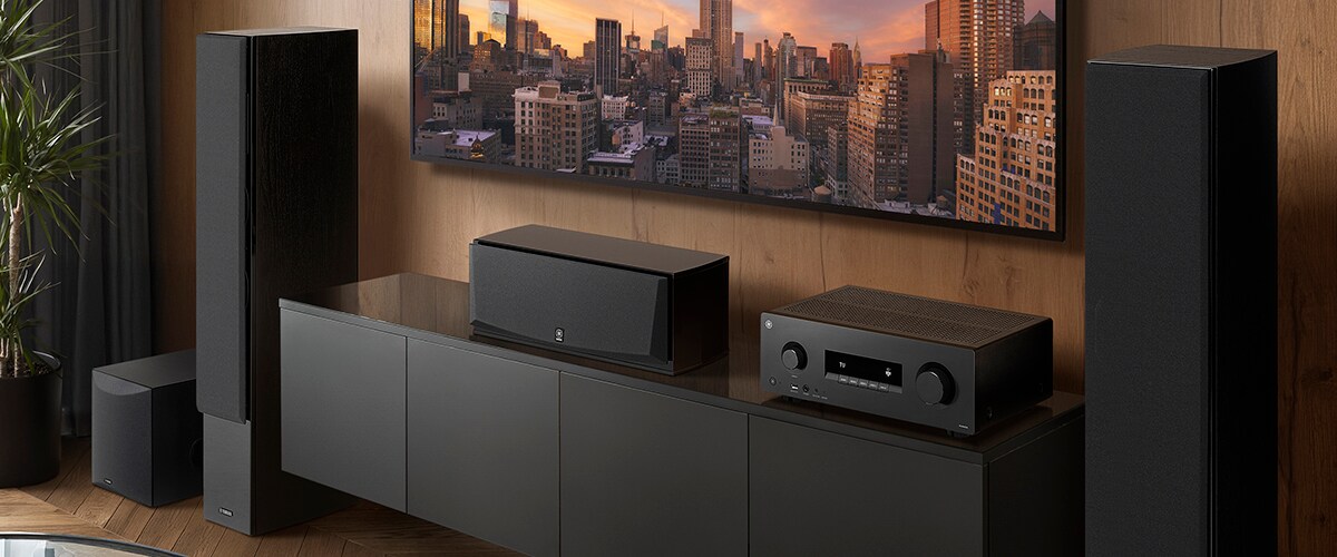 The RX500A, a centre speaker, front speakers and a subwoofer in a room.