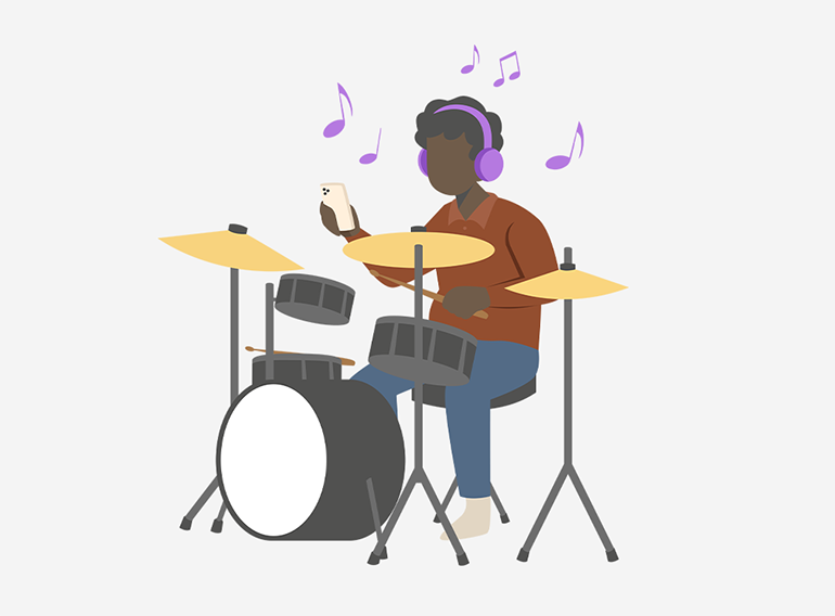 A man enjoying practising the drums using the stem separator function of the Extrack music practice app